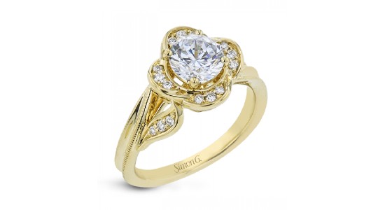 a yellow gold floral engagement ring by Simon G. with diamond accents