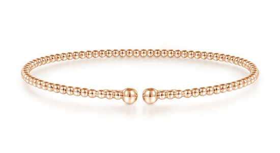 a rose gold bangle by Gabriel & Co. with spherical details