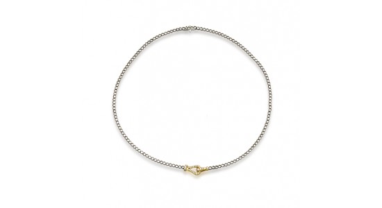 a white gold chain necklace by Simon G. with a yellow gold detail