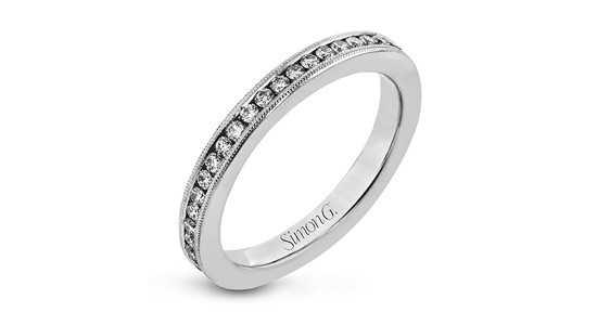 a platinum wedding band by Simon G. featuring channel set diamonds