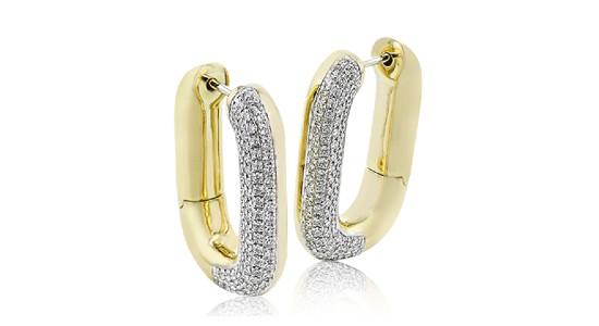 a pair of sculptural, mixed metal oval hoop earrings with diamond accents