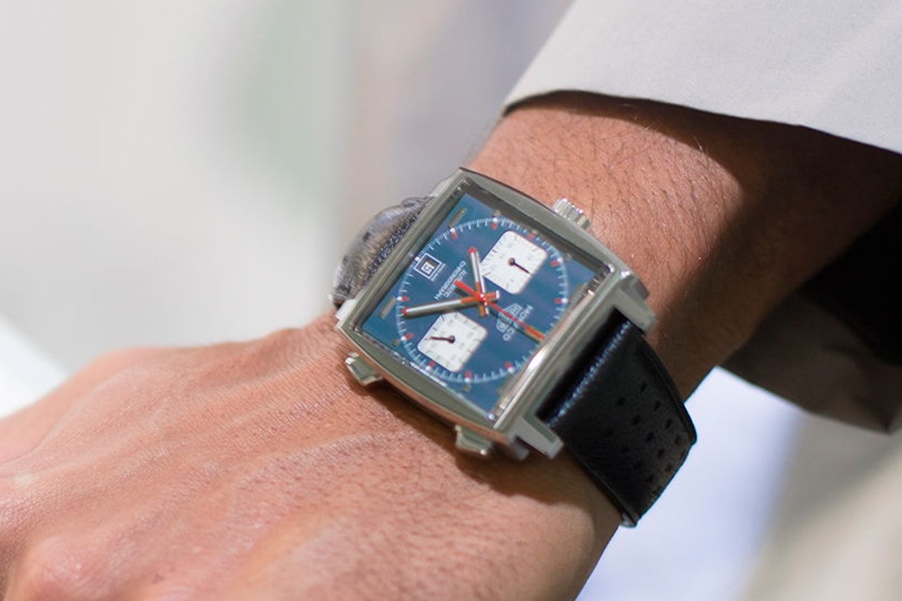 close up image of a man wearing a square TAG Heuer watch